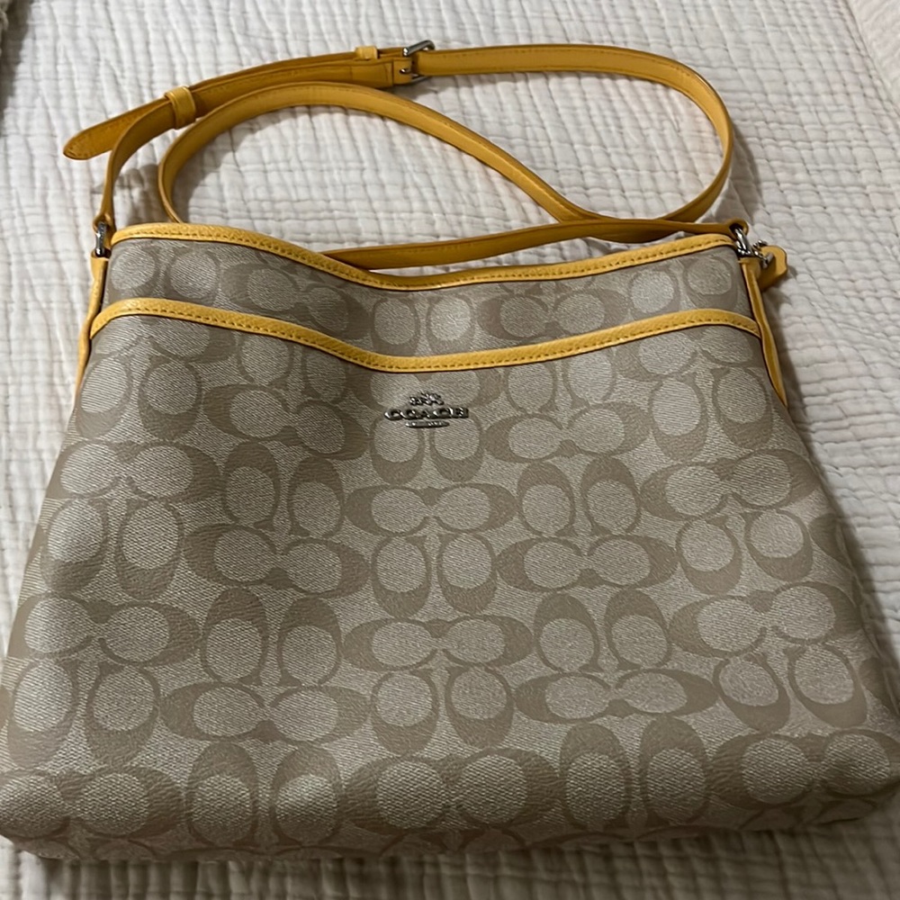 Coach Crossbody purse.  Tan and yellow detail.